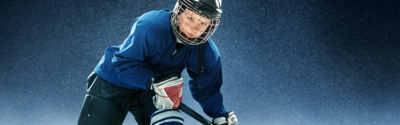 Little boy playing ice hockey Developmental Hockey Program